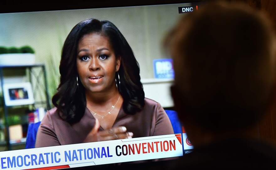 Former first lady Michelle Obama, and her necklace, urged viewers to vote on the opening night of the Democratic National Convention.