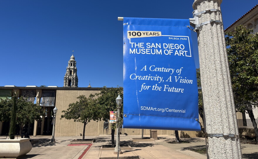 A sign on a flag pole at Balboa Park commemorates 100 years for the San Diego Museum of Art, Sept. 2, 2026.