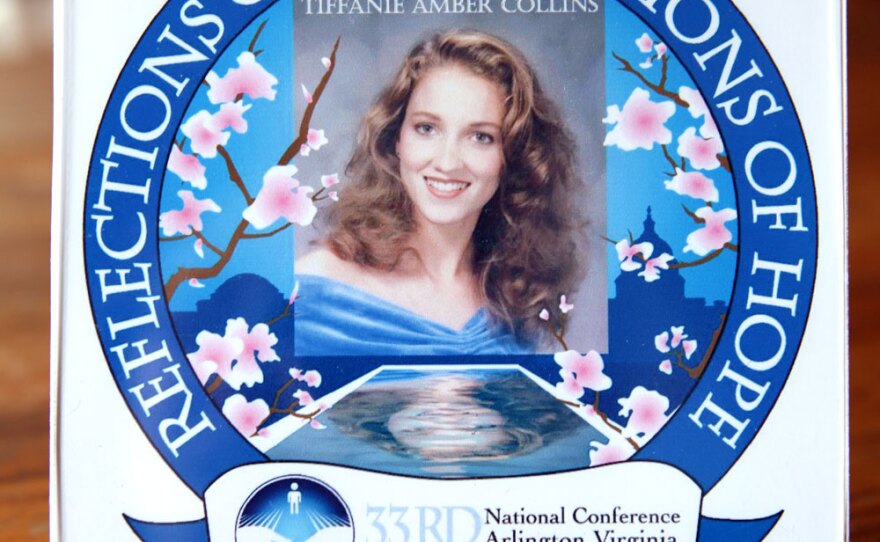 Kathy Collins is creating framed photo montages called "Reflections of Love" for the national conference. Parents can submit a photo of their child, and Kathy uses Photoshop to place it in a template featuring The Compassionate Friends logo. The example being used on the website and order form features their daughter Tiffanie.