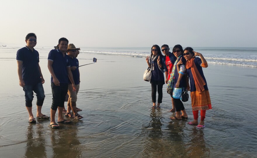 Tourists gather on the beach in Cox's Bazar, Bangladesh's current beach destination.