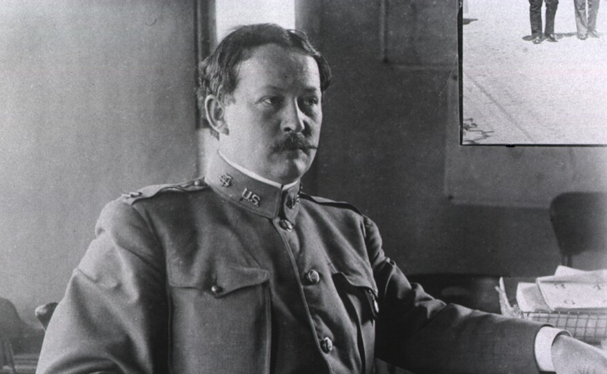 Dr. Rupert Blue dressed in the uniform of the United States Public Health and Marine Hospital Service, at his desk, during the San Francisco plague campaign.