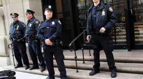 Police stand in front of the Federal Reserve Bank on October 17, 2012 in New York City. A Bangladeshi national was arrested Wednesday by Federal Authorities for allegedly plotting to blow up the Federal Reserve Bank in New York City.