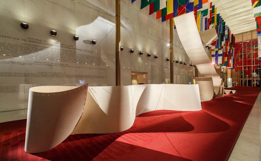 The Hall of Nations is transformed by a plywood installation called