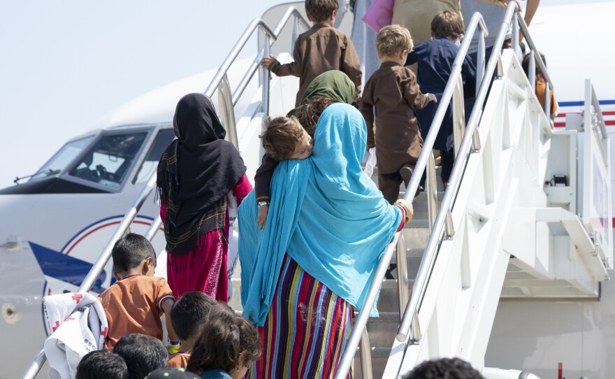 A group of vulnerable Afghans board a domestic United Airlines flight out of Dulles International airport on Aug. 26, 2021. Photo courtesy of United Airlines.