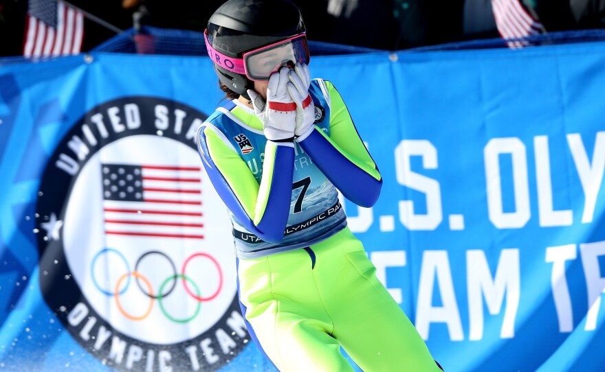 Sarah Hendrickson reacts after a jump in 2017 in Park City, Utah. She is shown wearing hip panels, prior to the change in uniform rules.