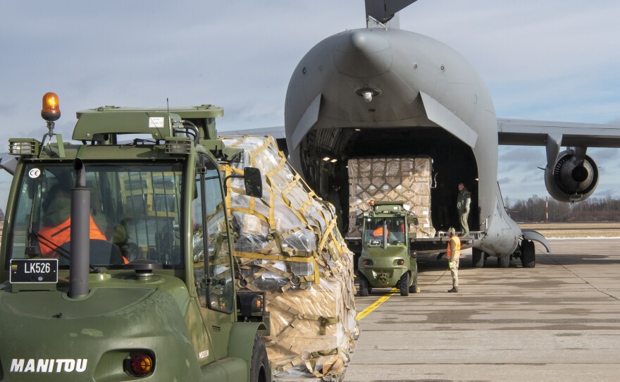 Lithuanian servicemen load Stinger anti-aircraft systems into military cargo plane at the Siauliai airbase on Feb. 12. The weapons were part of Lithuania's assistance to Ukraine. The Stingers have been used to bring down low-flying Russian planes and helicopters.
