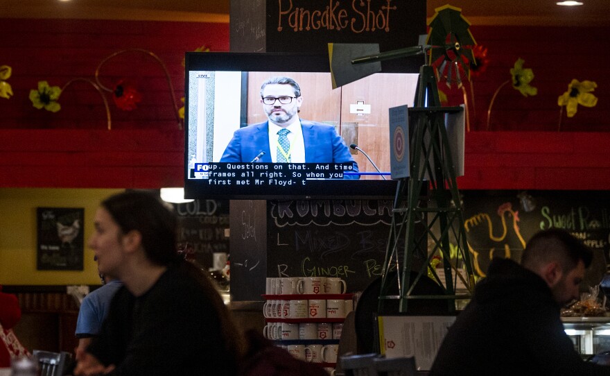 The trial of Derek Chauvin is now in its fifth day of witness testimony. Here, a Minneapolis restaurant shows the trial on TV in its dining room on Thursday.