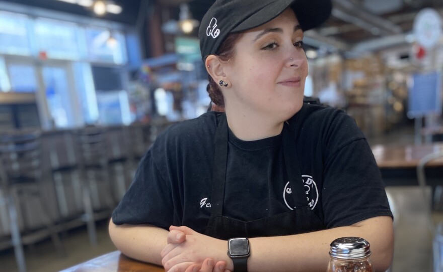 Gina Maria DiPaolo helps run Geno D's Pizza at the Market at 7th St in Charlotte, N.C. The "grandma-style" pies are a local favorite.