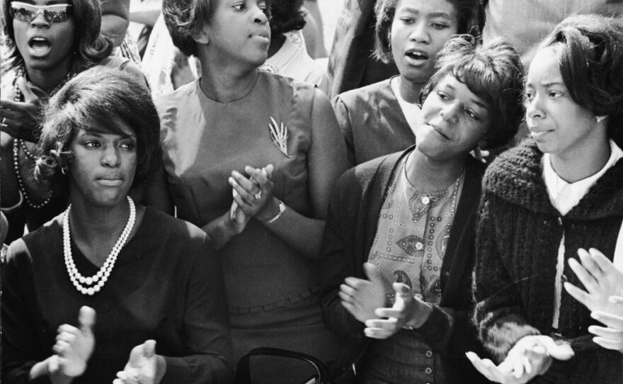 People clap and sing along to a freedom song between speeches at the March on Washington for Jobs and Freedom in 1963.