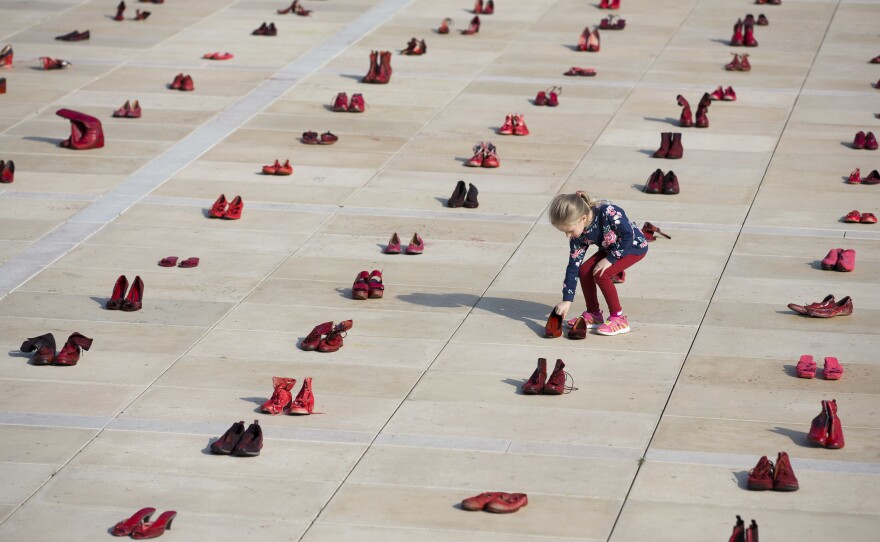 Hundreds of red shoes filled Tel Aviv's Habima Square on Tuesday, part of a nationwide protest to push the government to address violence against women.