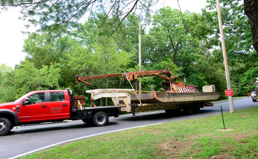 Salvage equipment to remove the capsized duck boat is transported to a staging area at Table Rock Lake near Branson, Mo. The U.S. Coast Guard oversaw the operation on Monday.