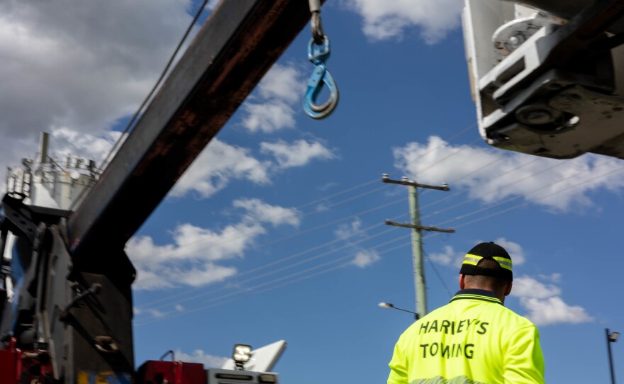 Tye Gray operating a Harvey's Towing truck, Park Ridge, Brisbane, Queensland, Australia.
