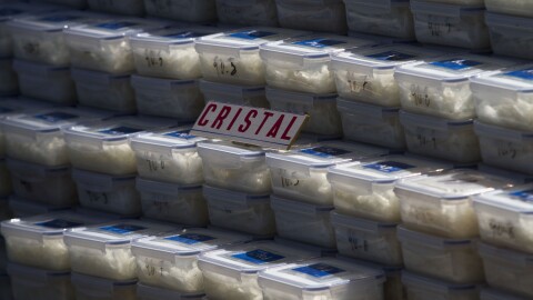 Plastic containers of crystal meth sit on display for the media in Tijuana, Mexico, Tuesday March 15, 2011.
