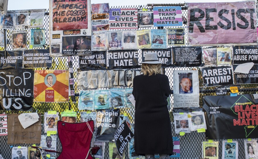 Signs on the fence surrounding the White House during the 2020 Presidential election. The fence, which came down in January 2021, once served as home to nearly 700+ signs and artwork during the course of the racial protests in D.C. following George Floyd's murder.