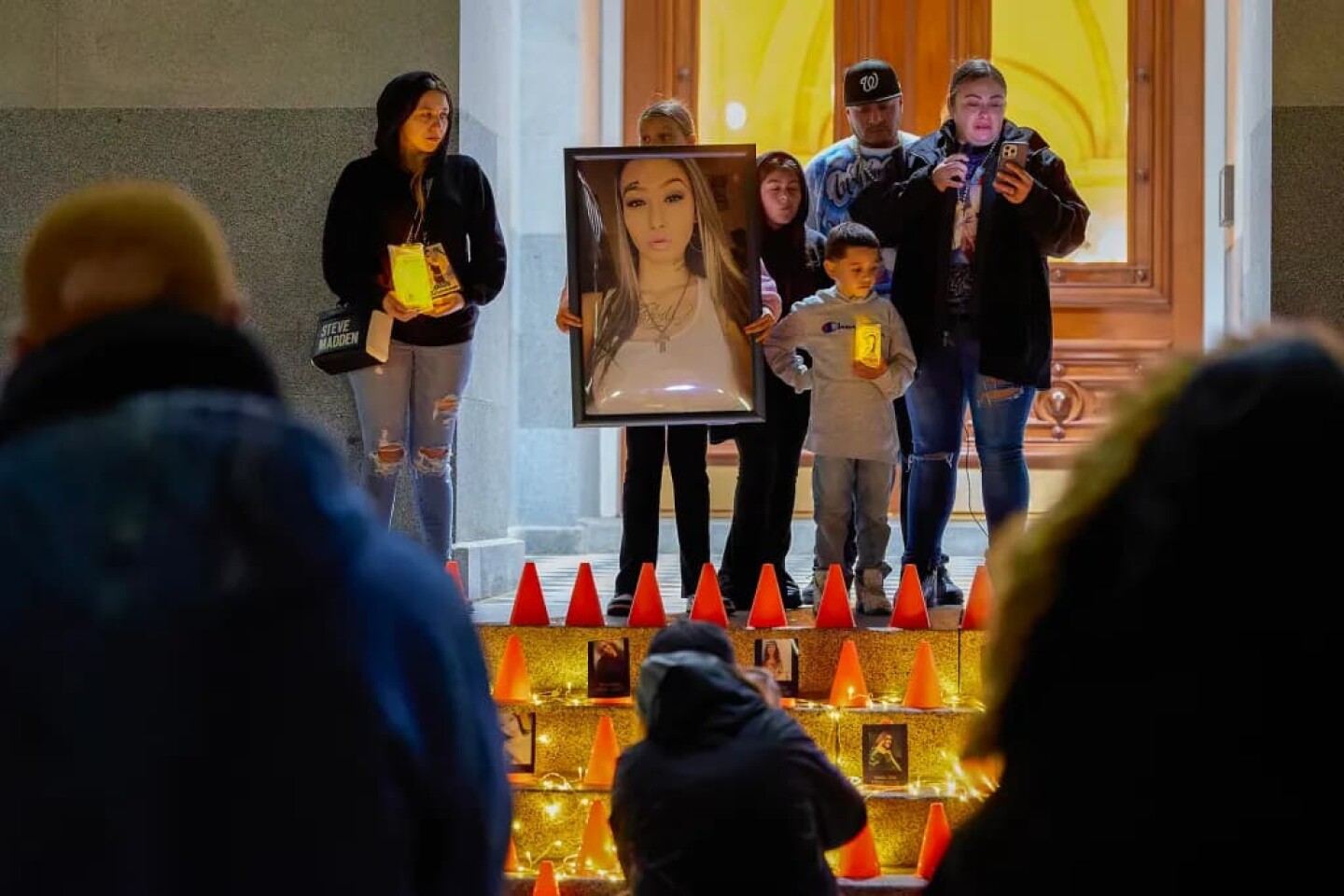 At far right, Fumiko Torres speaks about losing Rayanna Diaz while standing alongside other family members during a candlelight vigil as part of The World Day of Remembrance for Road Traffic Victims event at the Capitol in Sacramento on Nov. 16, 2025.
