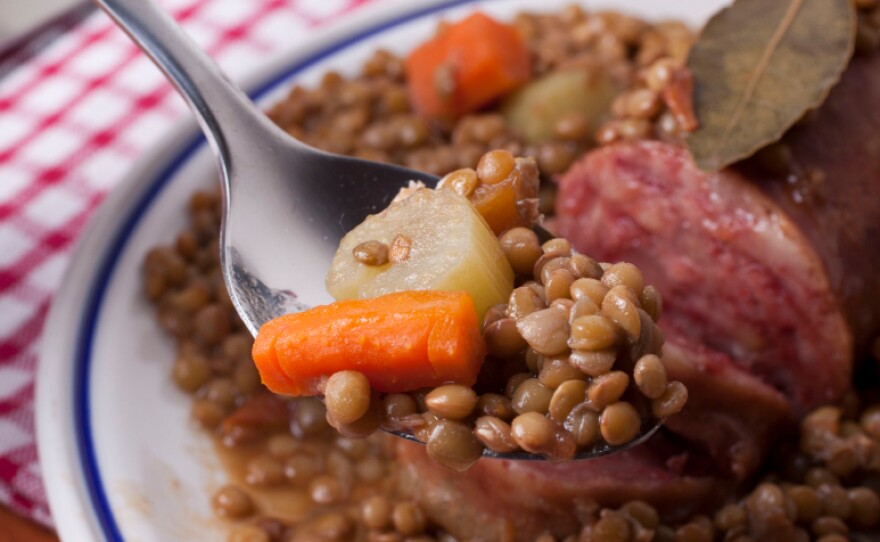 Italians munch on coin-shaped lentils with cotechino, a pork sausage that symbolizes the fat of the land.