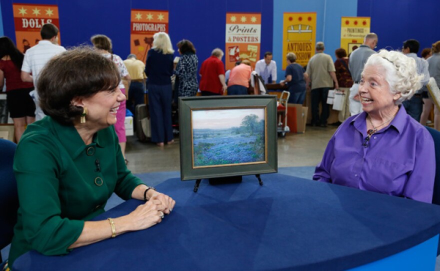 Debra J. Force (left) appraises a 1920 Julian Onderdonk oil painting for $125,000 in Kansas City, Mo.