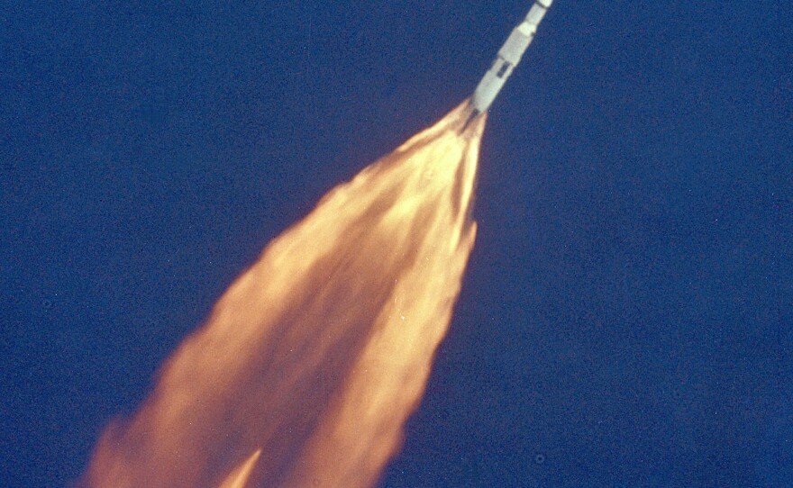 Apollo 11 climbs toward orbit after liftoff on July 16, 1969. In 2 1/2 minutes of powered flight, the S-IC booster lifts the vehicle to an altitude of about 39 miles, some 55 miles downrange.