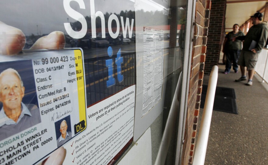 Before the voter ID law was put on hold, this Penndot Drivers License Center in Butler, Pa., displayed signs promoting the requirement for voters to show an acceptable photo ID at the polls.