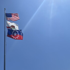 Juneteenth flag raised along with the American flag and California state flag during a special celebration at the San Diego Unified School District education center in Hillcrest, San Diego on June 16, 2023.