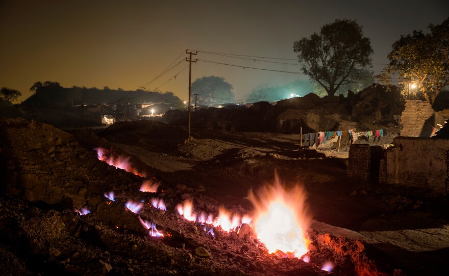 An underground fire has been burning for at least a century, according to villagers in Boka Pahari, on the outskirts of Jharia city. The fire, shown here in 2014, is some 200 yards from the village and is said to have started when abandoned coal mines were not properly closed.
