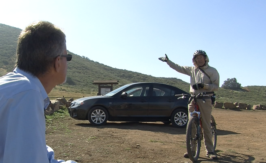 Volunteer botanist Jerry Green speaks to Rod Simmons, who helped construct new trails at Black Mountain Open Space Park in Rancho Peñasquitos, March 30, 2015.