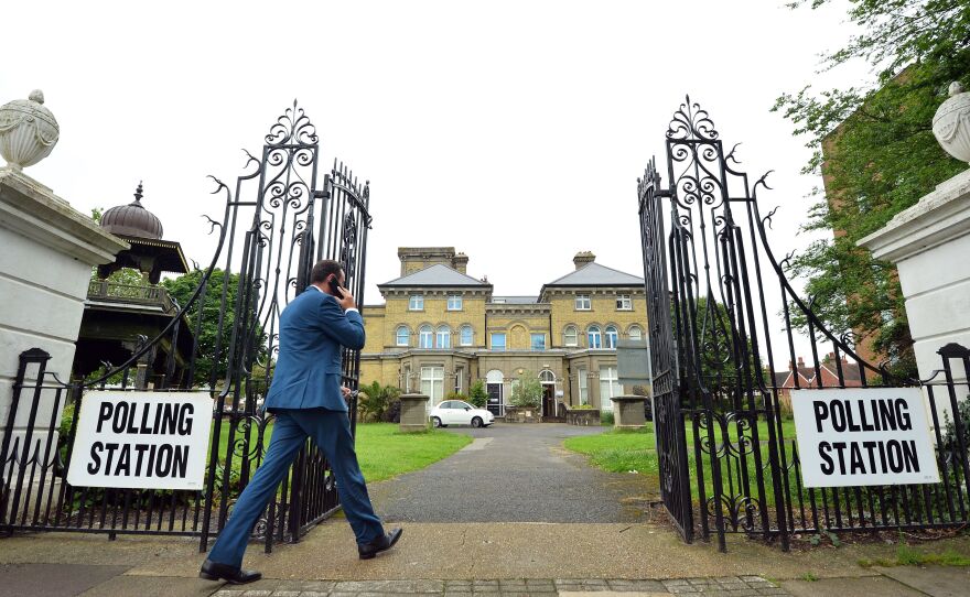 People arrive to cast their votes Thursday at Hove Museum and Art gallery in Hove, which is near Brighton in southern England. Millions of voters are having their say in a bitterly fought, knife-edge referendum that could tear up the United Kingdom's EU membership.