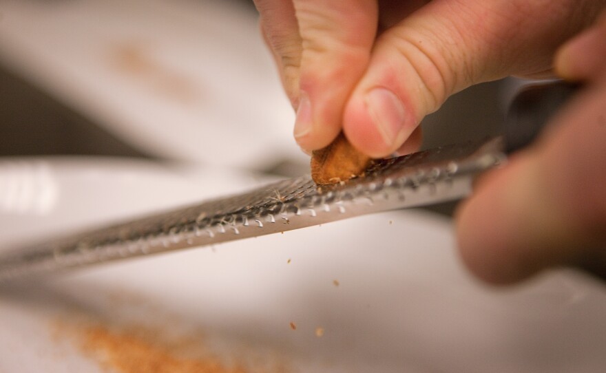 Grate a heavy pinch of nutmeg. Sprinkle it over the spinach as it cooks until wilted.