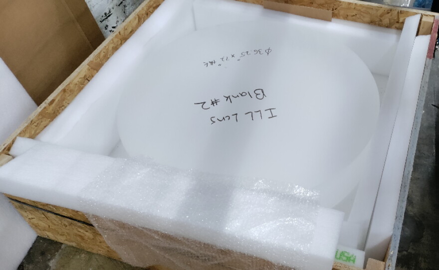 A photo from the U.S. General Services Administration auction site shows the aspheric test blank from NASA that was bid on for $300 this year.