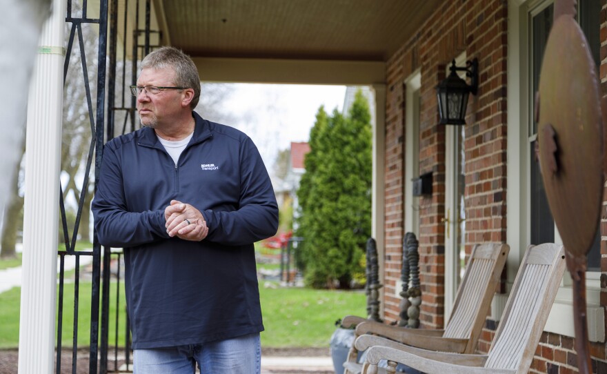 George Cooper, a truck driver for Kohler, stands on the front porch of his home. When he started his job at Kohler two years ago, Cooper realized his pay and benefits were no match to those of other drivers doing the same work.