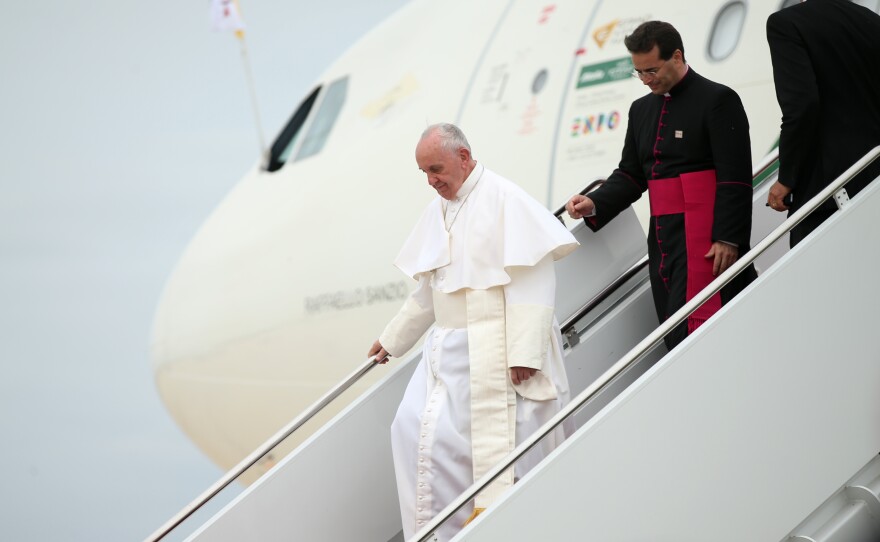 Pope Francis walks down the steps of his plane upon his arrival at Andrews Air Force Base, Md., on Tuesday.