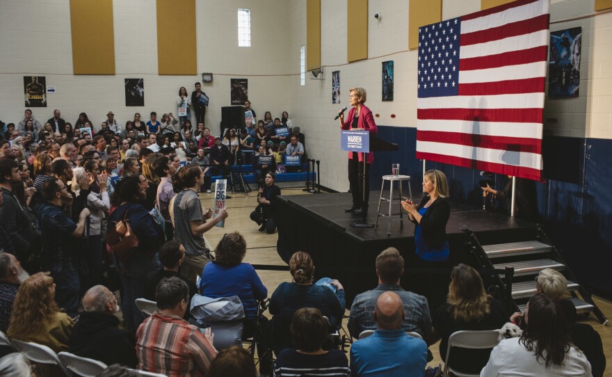 Warren speaks to a large crowd at a campaign stop at an elementary school in Columbus, Ohio.
