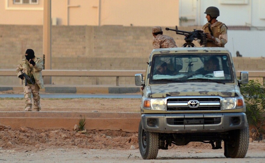 Libyan men loyal to rogue general Khalifa Hiftar take position during clashes against Islamists in the eastern Libyan city of Benghazi on June 2.