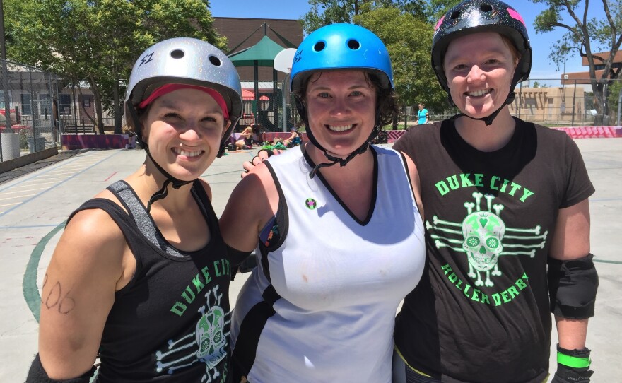 Lauren Winkler, Leigh Featherstone and Holly Chamberlin, left to right, all supporters of Hillary Clinton, at a roller derby scrimmage in Albuquerque, N.M.