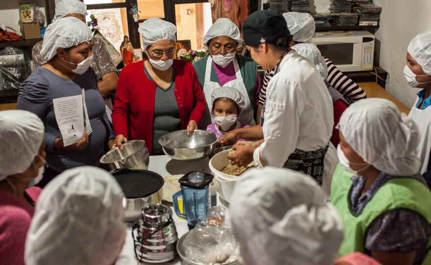 Gastronomy student Clarissa Moran (center) works with women in microenterprise groups to create new products with amaranth.