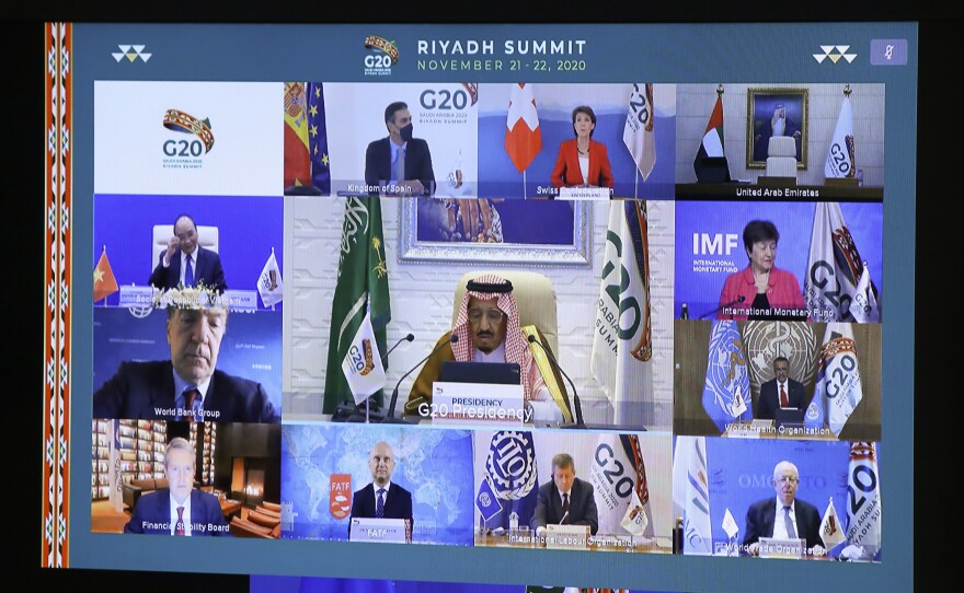 European Council President Charles Michel, on screen bottom, participates in a virtual G-20 meeting, hosted by Saudi Arabia, at the European Council building in Brussels on Saturday.