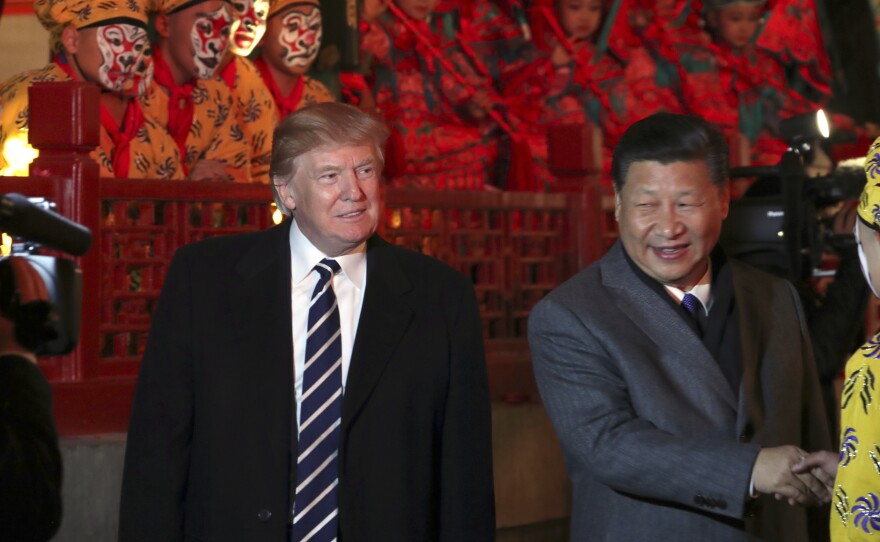 President Trump and Chinese President Xi Jinping arrive to watch an opera performance at the Forbidden City on Wednesday in Beijing.