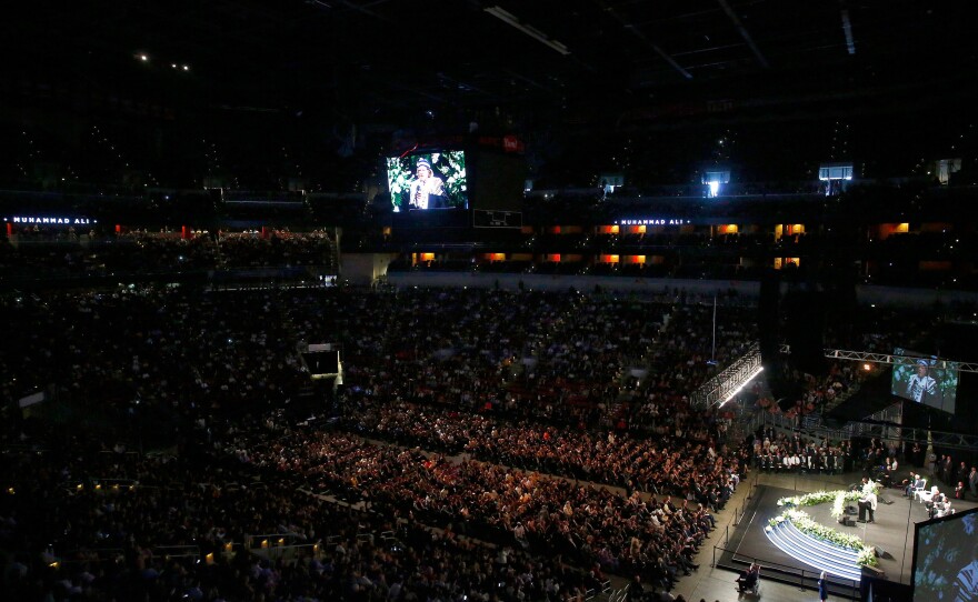 Guests look on during a memorial service for boxing legend Muhammad Ali at the KFC Yum Center in Louisville, Ky.