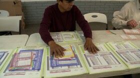 A poll worker in Tijuana organizes ballots for voters who are participating in the first-ever judicial elections in Mexico, June 6, 2025.