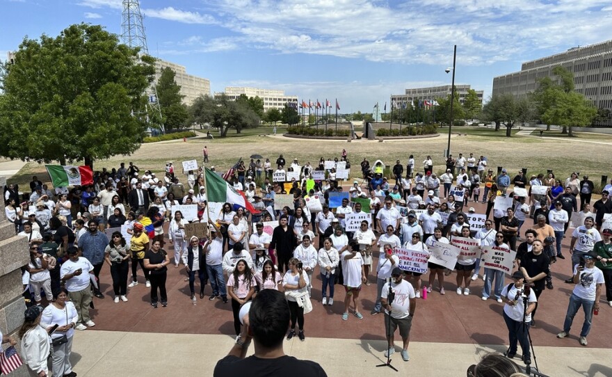 Oklahoma City immigration attorney Sam Wargin Grimaldo speaks to a group outside the Oklahoma Capitol on Tuesday, April 23, 2024, who opposed a bill that would impose criminal penalties to be in the state illegally. Oklahoma is one of several GOP-led states seeking to give broader immigration enforcement powers to local police. (AP Photo/Sean Murphy)