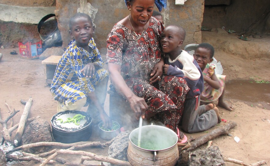 Banda resident Ama Georgina cooks a soup made from cassava leaves, a main source of nutrition during the hungry season.