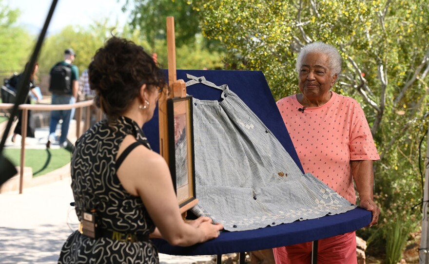 Martina D’Amato (left) appraises a formerly enslaved woman’s apron, ca. 1900, in Las Vegas, Nevada.