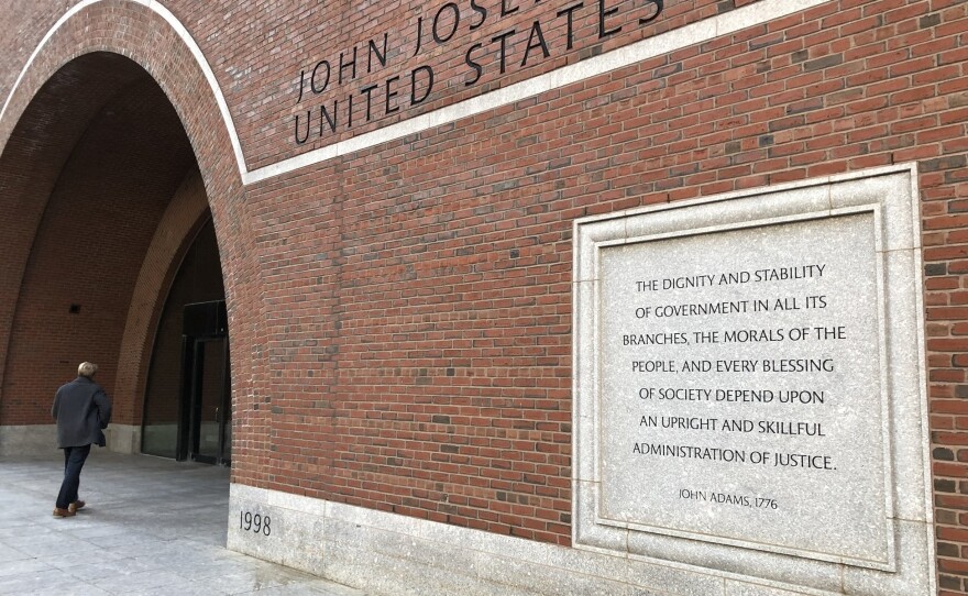 Etchings on the federal courthouse in Boston acclaim a well-administered justice system, but many working in the building say that is getting harder, given the continuing federal shutdown.