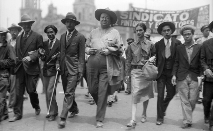 Diego Rivera, Frida Kahlo and other intellectuals march on Labor Day in Mexico, May 1, 1929. From episode 1, “The Making and Breaking.” (Secretaria De Cultura/INAH)