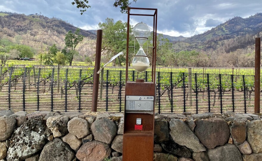 The entrance to Hourglass winery, with an evacuation tag from the Napa County Sheriff's Office from last year's Glass Fire blowing in the wind. Residents place these tags on their properties before evacuating, easing the job of first responders.
