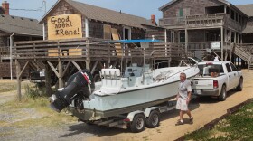 Residents pack their belongings as they prepare to evacuate in front of Hurricane Irene August 25, 2011 in Nags Head, North Carolina. 