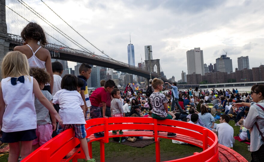 People gather to watch the Macy's Fourth of July fireworks show from Brooklyn Bridge Park, one of the newer developments along the East River, in 2015.