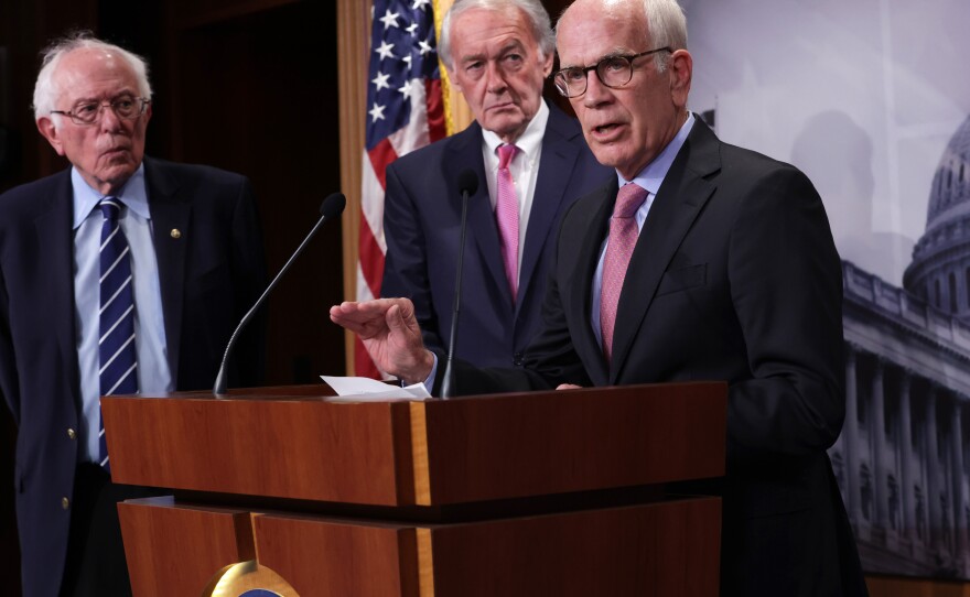 Democratic Sen. Peter Welch of Vermont, flanked by Sens. Bernie Sanders of Vermont and Ed Markey of Massachusetts, addressed concerns about debt limit negotiations during a press conference on Thursday. A group of Senate Democrats sent a letter to President Biden urging him to invoke the 14th Amendment to avoid a debt default if he can't reach a deal with Republicans.