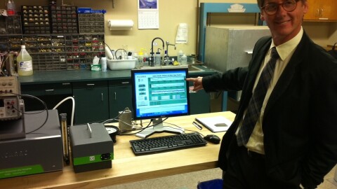 Scripps Institution of Oceanography Professor Ralph Keeling with an instrument in his lab that collects greenhouse gas emission data in San Diego. Keeling is one of the scientists working to deploy a new global GHG emissions monitoring network.