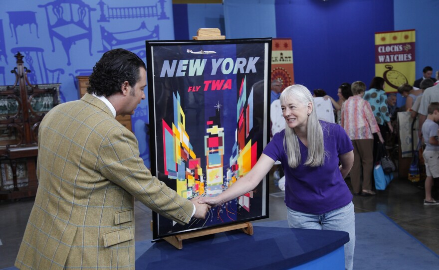 Nicholas Lowry (left) appraises a 1956 David Klein TWA poster in Phoenix, Ariz. ANTIQUES ROADSHOW “Vintage Phoenix 2025, Hour 2” premieres Monday, Oct. 20, 2025 at 8/7C PM on PBS.